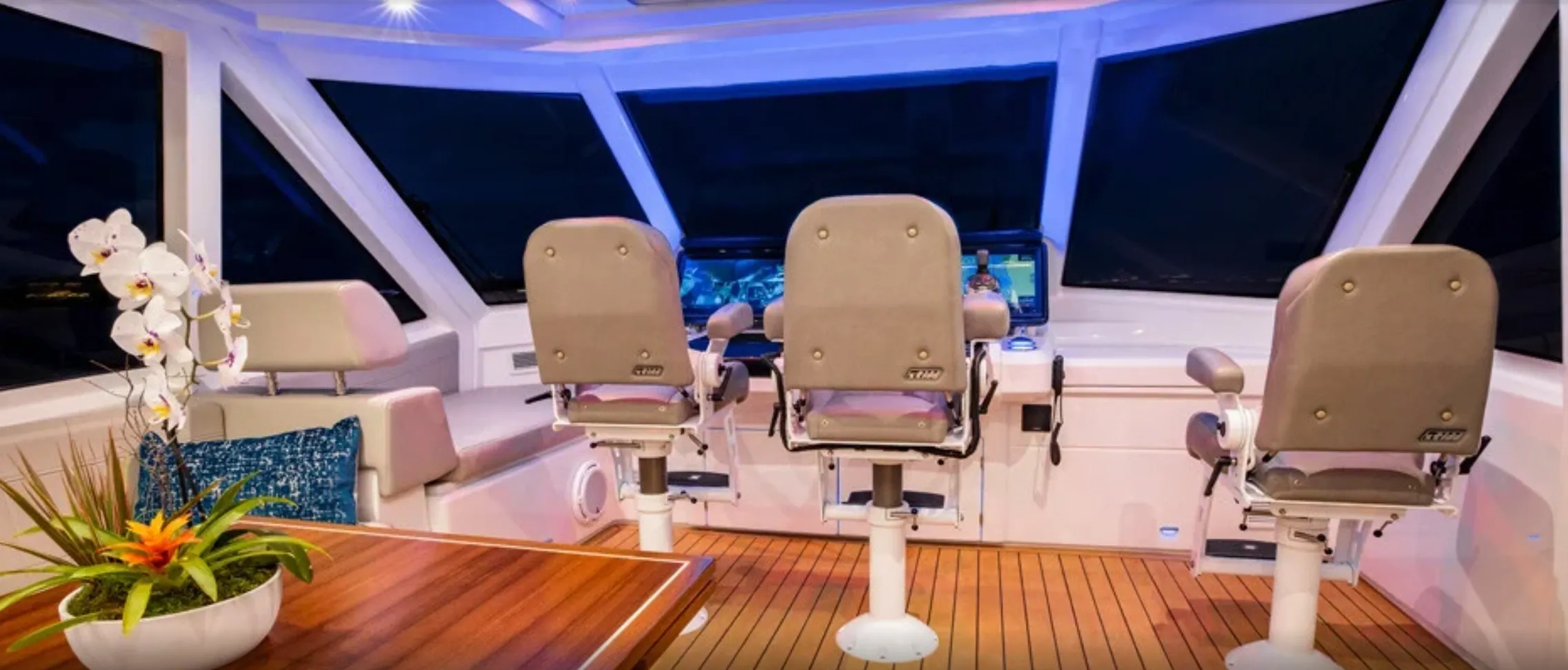 Luxury yacht interior with captain's chairs.