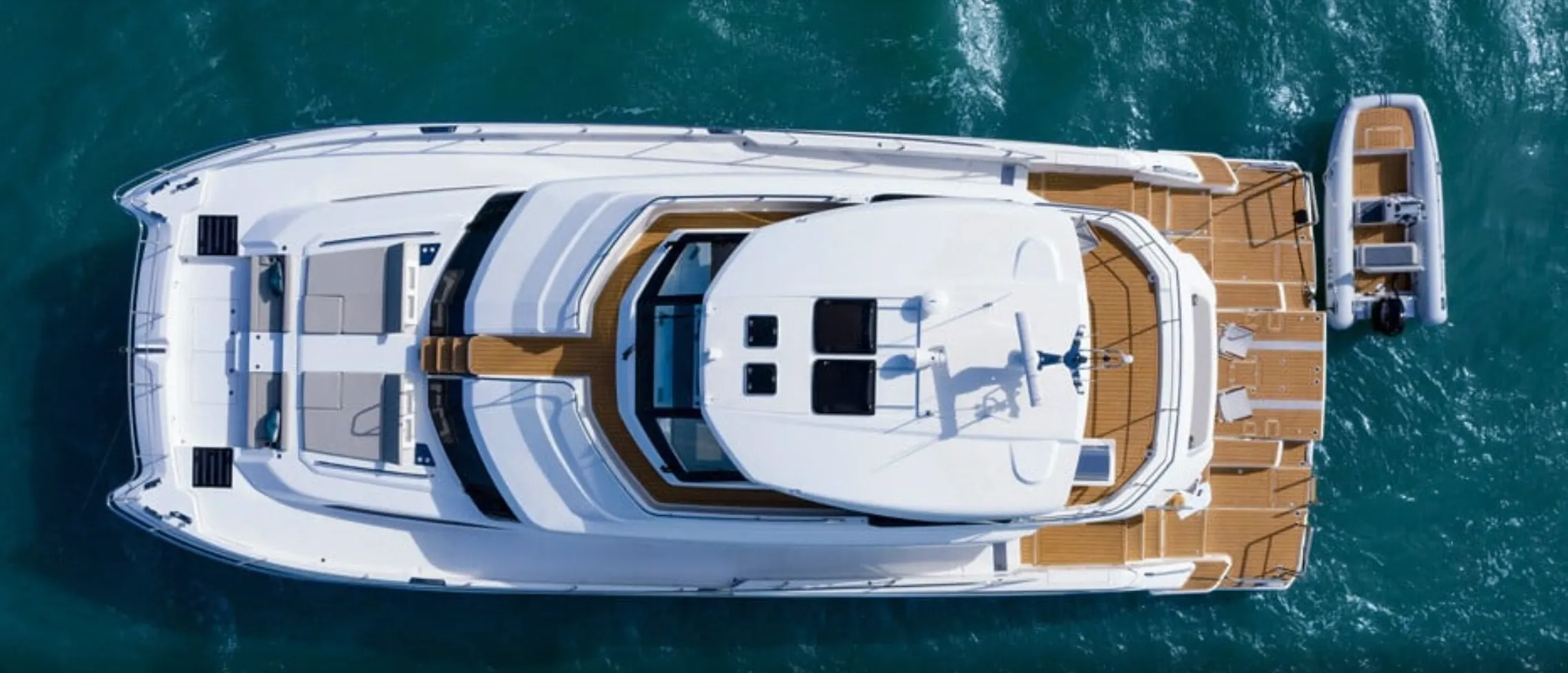 Aerial view of yacht and small boat.