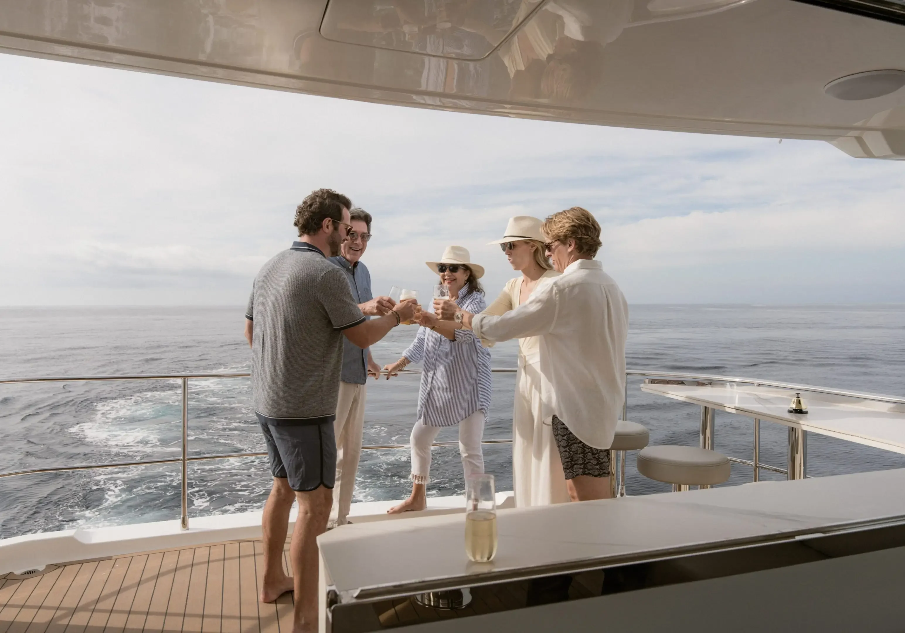 Group celebrating on a yacht at sea.